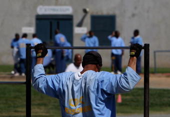 IONE, CA - AUGUST 28:  An inmate at the Mule Creek State Prison exercises through pull-ups in an outside yard August 28, 2007 in Ione, California. A panel of three federal judges is looking to put a cap on the California State Prison population after class action lawsuits were filed on behalf of inmates who complained of being forced to live in classrooms, gymnasiums and other non-traditional prison housing. California prisons house nearly 173,000 inmates with over 17,000 of them in non-traditional housing. The Mule Creek State Prison has had to modify several facilities to make room for an increasing number of inmates. (Photo by Justin Sullivan/Getty Images)