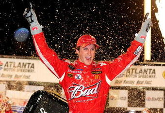HAMPTON, GA - SEPTEMBER 06:  Kasey Kahne, driver of the #9 Budweiser Dodge celebrates in victory lane after winning the NASCAR Sprint Cup Series Pep Boys Auto 500 at Atlanta Motor Speedway on September 6, 2009 in Hampton, Georgia.  (Photo by Rusty Jarrett/Getty Images for NASCAR)