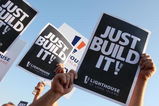UNIONDALE, NY - AUGUST 04:  Members of Local 406 rally for support at the Nassau Coliseum prior to marching to the Lighthouse project public hearing at the Adams Playhouse on the campus of Hofstra University on August 4, 2009  in Uniondale, New York.  (Photo by Mike Stobe/Getty Images)
