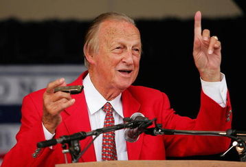 COOPERSTOWN, NY - JULY 31:  Stan Musial gets his harmonica ready to sing 'Take Me Out to the Ball Game' during the Baseball Hall of Fame induction ceremony on July 31, 2005 at the Clark Sports Complex in Cooperstown, New York.  (Photo by Ezra Shaw/Getty Images)