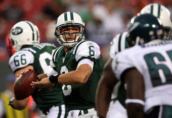 EAST RUTHERFORD, NJ - SEPTEMBER 3: Quarterback Mark Sanchez #6 of the New York Jets looks to make a pass play in the first quarter against the Philadelphia Eagles during the NFL preseason game at Giants Stadium on September 3, 2009 in East Rutherford, New Jersey. (Photo by Jim McIsaac/Getty Images)