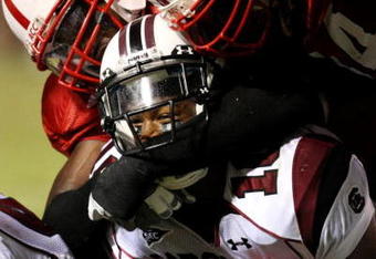 RALEIGH, NC - SEPTEMBER 3: Running back Brian Maddox #10 of the South Carolina Gamecocks is tackled during the game against the North Carolina State Wolfpack at Carter-Finley Stadium on September 3, 2009 in Raleigh, North Carolina. (Photo by Streeter Lecka/Getty Images)