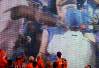 BOISE, ID - SEPTEMBER 3:  Boise State fans watch the video board as LaGarrette Blount #9 of the Oregon Ducks is shown punching a Boise State Broncos player after the game causing quite a commotion and talk of him being arrested on September 3, 2009 at Bronco Stadium in Boise, Idaho. Boise State defeated Oregon 19-8.(Photo by Steve Dykes/Getty Images)