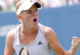 NEW YORK - SEPTEMBER 07:  Melanie Oudin of the United States celebrates after winning the second set in a tie break against Nadia Petrova of Russia during day eight of the 2009 U.S. Open at the USTA Billie Jean King National Tennis Center on September 7, 2009 in the Flushing neighborhood of the Queens borough of New York City.  (Photo by Matthew Stockman/Getty Images)