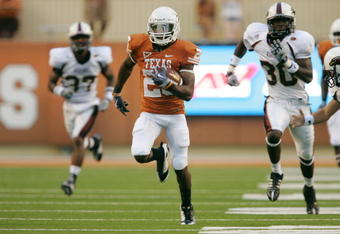 AUSTIN, TX - SEPTEMBER 05:  D.J. Monroe #26 of the Texas Longhorns returns a kickoff for a touchdown against the Louisiana Monroe Warhawks in the second quarter on September 5, 2009 at Darrell K Royal-Texas Memorial Stadium in Austin, Texas.  (Photo by Brian Bahr/Getty Images)