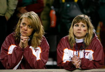 BLACKSBURG, VA - OCTOBER 25:  Two Virginia Tech Hokies' fans react after the Boston College Eagles scored the game-winning touchdown in the final seconds of the game at Lane Stadium October 25, 2007 in Blacksburg, Virginia.  Boston College defeated Virginia Tech 14-10.  (Photo by Kevin C. Cox/Getty Images)