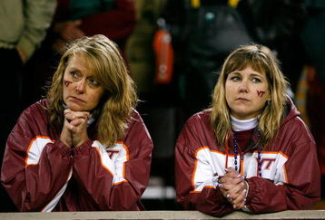 BLACKSBURG, VA - OCTOBER 25:  Two Virginia Tech Hokies' fans react after the Boston College Eagles scored the game-winning touchdown in the final seconds of the game at Lane Stadium October 25, 2007 in Blacksburg, Virginia.  Boston College defeated Virginia Tech 14-10.  (Photo by Kevin C. Cox/Getty Images)
