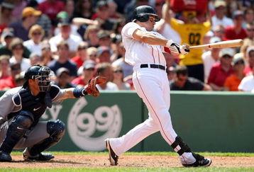 BOSTON - JULY 05:  Jacoby Ellsbury #46 of the Boston Red Sox hits a solo home run in the sixth inning as Kenji Johjima #2 of the Seattle Mariners defends on July 5, 2009 at Fenway Park in Boston, Massachusetts.  (Photo by Elsa/Getty Images)