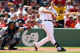 BOSTON - JULY 05:  Jacoby Ellsbury #46 of the Boston Red Sox hits a solo home run in the sixth inning as Kenji Johjima #2 of the Seattle Mariners defends on July 5, 2009 at Fenway Park in Boston, Massachusetts.  (Photo by Elsa/Getty Images)