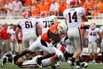 STILLWATER, OK - SEPTEMBER 5:   Dexter Pratt #22 of the Oklahoma State Cowboys pressures quarterback Joe Cox #14 of the Georgia Bulldogs during the second quarter of the game at Boone Pickens Stadium on September 5, 2009 in Stillwater, Oklahoma. (Photo by Christian Petersen/Getty Images)