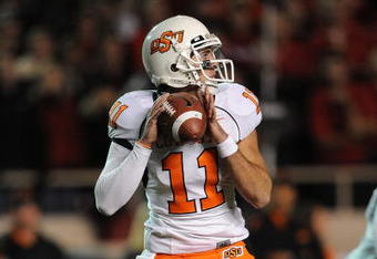 LUBBOCK, TX - NOVEMBER 08:  Quarterback Zac Robinson #11 of the Oklahoma State Cowboys during play against the Texas Tech Red Raiders at Jones AT&T Stadium on November 8, 2008 in Lubbock, Texas.  (Photo by Ronald Martinez/Getty Images)