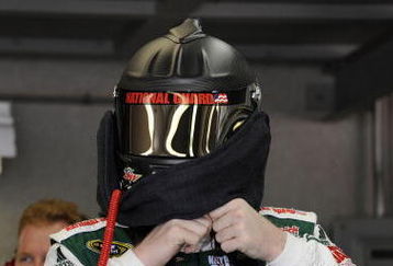 INDIANAPOLIS - JULY 24:  Dale Earnhardt Jr., driver of the #88 AMP Energy/National Guard Chevrolet, puts on his helmet in the garage prior to practice for the NASCAR Sprint Cup Series Allstate 400 at the Brickyard at Indianapolis Motor Speedway on July 24, 2009 in Indianapolis, Indiana.  (Photo by John Harrelson/Getty Images for NASCAR)