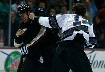 ANAHEIM, CA - APRIL 27:  (R-L) Center Joe Thornton #19 of the San Jose Sharks fights with center Ryan Getzlaf #15 of the Anaheim Ducks at the beginning of Game Six of the Western Conference Quarterfinal Round of the 2009 Stanley Cup Playoffs at the Honda Center on April 27, 2009 in Anaheim, California.  (Photo by Jeff Gross/Getty Images)