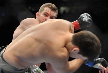 PORTLAND, OR - AUGUST 29:  UFC fighter Nate Marquardt (L) knocks out UFC fighter Demian Maia (R) during their Middleweight bout at UFC 102:  Couture vs. Nogueira at the Rose Garden Arena on August 29, 2009 in Portland, Oregon.  (Photo by Jon Kopaloff/Getty Images)