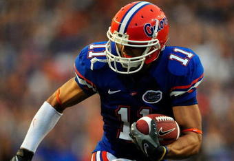 GAINESVILLE, FL - SEPTEMBER 05:  Riley Cooper #11 of the Florida Gators runs for yardage during the game against the Charleston Southern Buccaneers at Ben Hill Griffin Stadium on September 5, 2009 in Gainesville, Florida.  (Photo by Sam Greenwood/Getty Images)