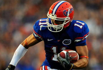 GAINESVILLE, FL - SEPTEMBER 05:  Riley Cooper #11 of the Florida Gators runs for yardage during the game against the Charleston Southern Buccaneers at Ben Hill Griffin Stadium on September 5, 2009 in Gainesville, Florida.  (Photo by Sam Greenwood/Getty Images)