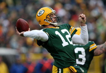 GREEN BAY, WI - NOVEMBER 30:  Aaron Rodgers #12 of the Green Bay Packers throws a pass against the Carolina Panthers at Lambeau Field on November 30, 2008 in Green Bay, Wisconsin. The Panthers won 35-31.  (Photo by Jonathan Daniel/Getty Images)