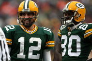 GREEN BAY, WI - NOVEMBER 30:  Aaron Rodgers #12 and Donald Driver #80  of the Green Bay Packers look on against the Carolina Panthers at Lambeau Field on November 30, 2008 in Green Bay, Wisconsin. The Panthers won 35-31.  (Photo by Jonathan Daniel/Getty Images)