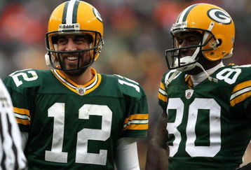GREEN BAY, WI - NOVEMBER 30:  Aaron Rodgers #12 and Donald Driver #80  of the Green Bay Packers look on against the Carolina Panthers at Lambeau Field on November 30, 2008 in Green Bay, Wisconsin. The Panthers won 35-31.  (Photo by Jonathan Daniel/Getty Images)
