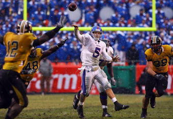 KANSAS CITY, MO - NOVEMBER 29:  Quarterback Todd Reesing #5 of the Kansas Jayhawks passes during the second half of the game against the Missouri Tigers on November 29, 2008 at Arrowhead Stadium in Kansas City, Missouri.  (Photo by Jamie Squire/Getty Images)