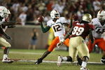 TALLAHASSEE, FL - SEPTEMBER 07:  Quarterback Jacory Harris #12 of the Miami Hurricanes throws a touchdown pass in the fourth quarter to Graig Cooper #2 against the Florida State Seminoles at Doak Campbell Stadium on September 7, 2009 in Tallahassee, Florida. Miami defeated Florida State 38-34.  (Photo by Doug Benc/Getty Images)
