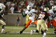 TALLAHASSEE, FL - SEPTEMBER 07:  Quarterback Jacory Harris #12 of the Miami Hurricanes throws a touchdown pass in the fourth quarter to Graig Cooper #2 against the Florida State Seminoles at Doak Campbell Stadium on September 7, 2009 in Tallahassee, Florida. Miami defeated Florida State 38-34.  (Photo by Doug Benc/Getty Images)