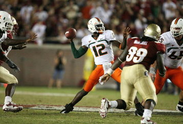 TALLAHASSEE, FL - SEPTEMBER 07:  Quarterback Jacory Harris #12 of the Miami Hurricanes throws a touchdown pass in the fourth quarter to Graig Cooper #2 against the Florida State Seminoles at Doak Campbell Stadium on September 7, 2009 in Tallahassee, Florida. Miami defeated Florida State 38-34.  (Photo by Doug Benc/Getty Images)