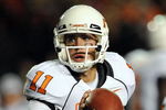 LUBBOCK, TX - NOVEMBER 08:  Quarterback Zac Robinson #11 of the Oklahoma State Cowboys during play against the Texas Tech Red Raiders at Jones AT&T Stadium on November 8, 2008 in Lubbock, Texas.  (Photo by Ronald Martinez/Getty Images)