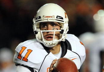 LUBBOCK, TX - NOVEMBER 08:  Quarterback Zac Robinson #11 of the Oklahoma State Cowboys during play against the Texas Tech Red Raiders at Jones AT&T Stadium on November 8, 2008 in Lubbock, Texas.  (Photo by Ronald Martinez/Getty Images)