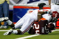 ATLANTA - SEPTEMBER 05: Running back Roy Upchurch #5 of the Alabama Crimson Tide is tackled as he scores a touchdown over Dorian Porch #24 of the Virginia Tech Hokies during the Chick-fil-A Kickoff Game at Georgia Dome on September 5, 2009 in Atlanta, Georgia. (Photo by Kevin C. Cox/Getty Images)