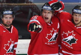 BERN, SWITZERLAND - MAY 07:  Dany Heatley of Canada celebrates with team-mates Dan Hamhuis (L) and Jason Spezza after scoring during the IIHF World Championship Quarter-Final between Canada and Latvia at the PostFinance Arena on May 7, 2009 in Bern, Switzerland.  (Photo by Mike Hewitt/Getty Images)