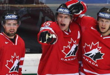 BERN, SWITZERLAND - MAY 07:  Dany Heatley of Canada celebrates with team-mates Dan Hamhuis (L) and Jason Spezza after scoring during the IIHF World Championship Quarter-Final between Canada and Latvia at the PostFinance Arena on May 7, 2009 in Bern, Switzerland.  (Photo by Mike Hewitt/Getty Images)