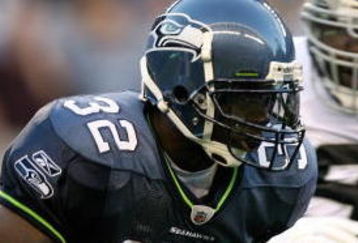 SEATTLE - SEPTEMBER 03:  Running back Edgerrin James  #32 of the Seattle Seahawks rushes against the Oakland Raiders on September 3, 2009 at Qwest Field in Seattle, Washington. (Photo by Otto Greule Jr/Getty Images)
