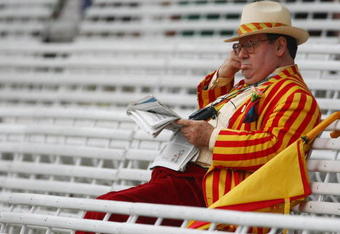 LONDON - MAY 16:  MCC member reads his newspaper as play is delayed for bad light during the second day of the 1st npower Test Match between England and New Zealand at Lord's on May 16, 2008 in London, England.  (Photo by Clive Rose/Getty Images)