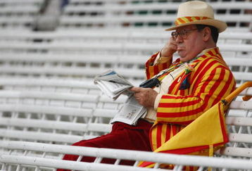 LONDON - MAY 16:  MCC member reads his newspaper as play is delayed for bad light during the second day of the 1st npower Test Match between England and New Zealand at Lord's on May 16, 2008 in London, England.  (Photo by Clive Rose/Getty Images)