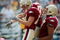 CHESTNUT HILL, MA - SEPTEMBER 05:  Billy Flutie #14 of the Boston College Eagles is congratulated by teammates Lars Anderson #87 and Mike Naples #89 after Flutie scored a touchdown against the Northeastern Huskies on September 5, 2009 at Alumni Stadium in Chestnut Hill, Massachusetts.  (Photo by Elsa/Getty Images)