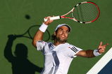 NEW YORK - SEPTEMBER 06:  Fernando Gonzalez of Chile serves to Tomas Berdych of the Czech Republic during day seven of the 2009 U.S. Open at the USTA Billie Jean King National Tennis Center on September 6, 2009 in the Flushing neighborhood of the Queens borough of New York City.  (Photo by Chris McGrath/Getty Images)