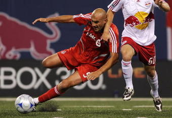EAST RUTHERFORD, NJ - OCTOBER 04:  Danny Dichio #9 of the Toronto FC and Jeff Parke # 60 of the New York Red Bulls battle for the ball at Giants Stadium in the Meadowlands on October 4, 2008 in East Rutherford, New Jersey. Toronto defeated New York 3-1.  (Photo by Mike Stobe/Getty Images for New York Red Bulls)