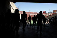 LOS ANGELES - SEPTEMBER 5:  San Jose State Spartans players walk out of the tunnel onto the field before the game with the USC Trojans on September 5, 2009 at the Los Angeles Coliseum in Los Angeles, California.   (Photo by Stephen Dunn/Getty Images)