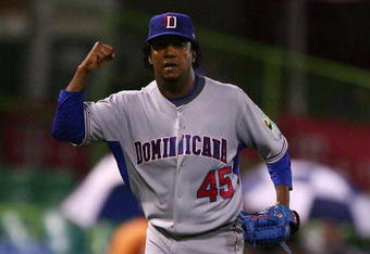 SAN JUAN, PUERTO RICO - MARCH 10:  Pedro Martinez #45 of The Dominican Republic celebrates getting out of the seventh inning against The Netherlands during the 2009 World Baseball Classic Pool D match on March 10, 2009 at Hiram Bithorn Stadium in San Juan, Puerto Rico.  (Photo by Al Bello/Getty Images)