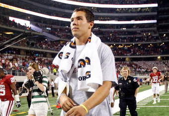 ARLINGTON, TX - SEPTEMBER 05:  Quarterback Sam Bradford #14 of the Oklahoma Sooners walks off the field after a 14-13 loss against the Brigham Young Cougars at Cowboys Stadium on September 5, 2009 in Arlington, Texas.  Bradford suffered an injury in the second quarter and did not return to the game.  (Photo by Ronald Martinez/Getty Images)