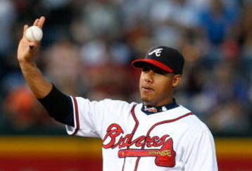 ATLANTA - AUGUST 22:  Shortstop Yunel Escobar #19 of the Atlanta Braves shows the ball after tagging out Chris Goghlan #8 of the Florida Marlins at second base on August 22, 2009 at Turner Field in Atlanta, Georgia.  (Photo by Kevin C. Cox/Getty Images)