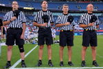 DENVER - JULY 16:  The referees observe the national anthem as the Old School prepares to face the Young Guns during the 2009 Major League Lacrosse All Star Game at INVESCO Field at Mile High on July 16, 2009 in Denver, Colorado. The Old School team defeated the Young Guns 22-21 in overtime.  (Photo by Doug Pensinger/Getty Images)