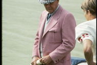 Coach Bear Bryant of the Alabama Crimson Tide watches his players during a game.