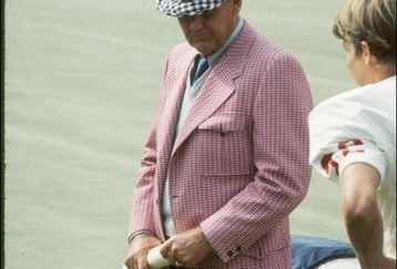 Coach Bear Bryant of the Alabama Crimson Tide watches his players during a game.