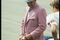 Coach Bear Bryant of the Alabama Crimson Tide watches his players during a game.