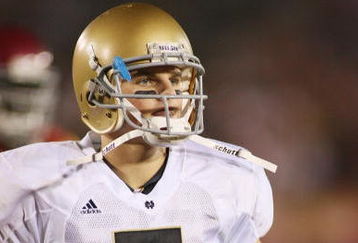 LOS ANGELES - NOVEMBER 29:  Jimmy Clausen #7 of the Notre Dame Fighting Irish walks on the field against the USC Trojans on November 29, 2008 at the Los Angeles Memorial Coliseum in Los Angeles, California.  USC won 38-3.  (Photo by Jeff Golden/Getty Images)
