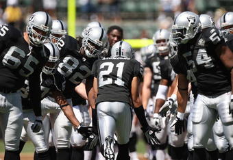 OAKLAND, CA - AUGUST 29:  Nnamdi Asomugha #21 of the Oakland Raiders is introduced against the New Orleans Saints during an NFL preseason game at Oakland-Alameda County Coliseum on August 29, 2009 in Oakland, California.  (Photo by Jed Jacobsohn/Getty Images)