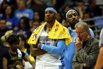 DENVER - MAY 29:  Carmelo Anthony #15 of the Denver Nuggets looks on from the bench in the fourth quarter of Game Six of the Western Conference Finals during the 2009 NBA Playoffs against the Los Angeles Lakers at Pepsi Center on May 29, 2009 in Denver, Colorado. NOTE TO USER: User expressly acknowledges and agrees that, by downloading and or using this photograph, User is consenting to the terms and conditions of the Getty Images License Agreement.  (Photo by Doug Pensinger/Getty Images)