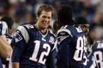 FOXBORO, MA - SEPTEMBER 03:  Tom Brady #12 of the New England Patriots and Randy Moss #81 celebrate in the fourth quarter against the New York Giants on September 3, 2009 at Gillette Stadium in Foxboro, Massachusetts. The Patriots defeated the Giants 38-27.  (Photo by Elsa/Getty Images)